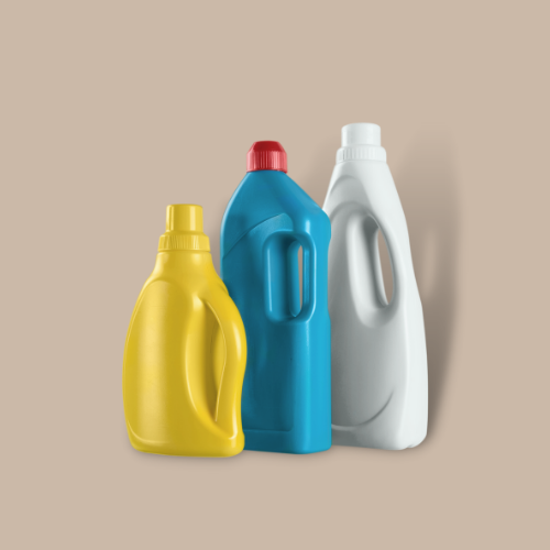 3 laundry detergent bottles against brown background