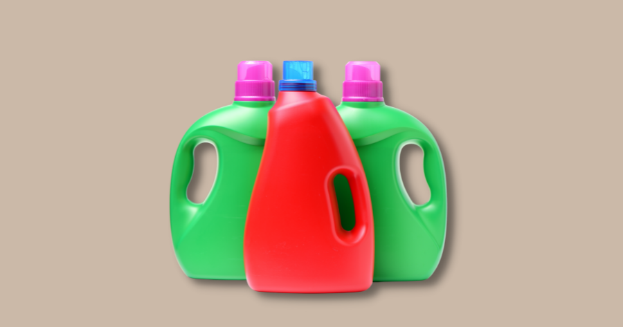 3 bottles of liquid laundry detergent against brown background