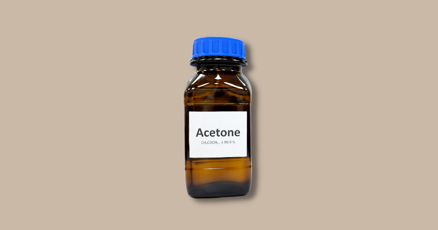 bottle of acetone against brown background