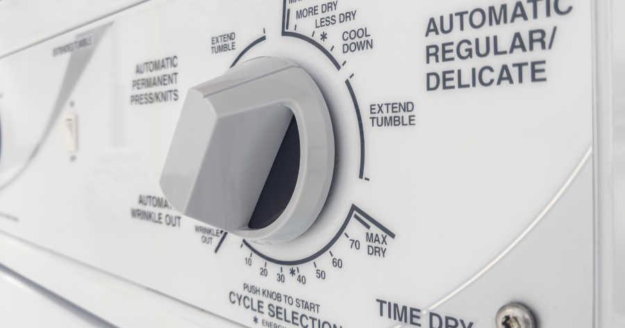 close up photo of dryer control knob panel