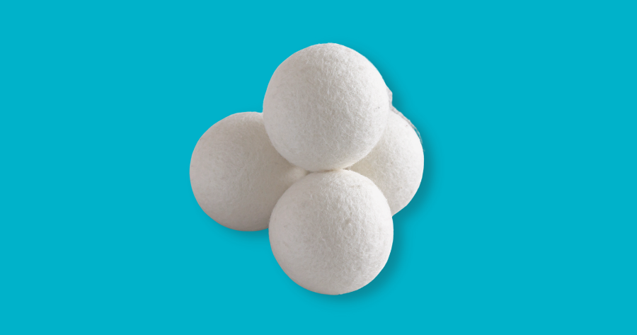 wool dryer balls against blue background