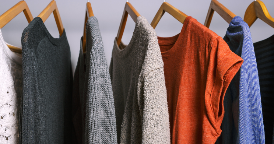 different colored clothes hanged using hangers