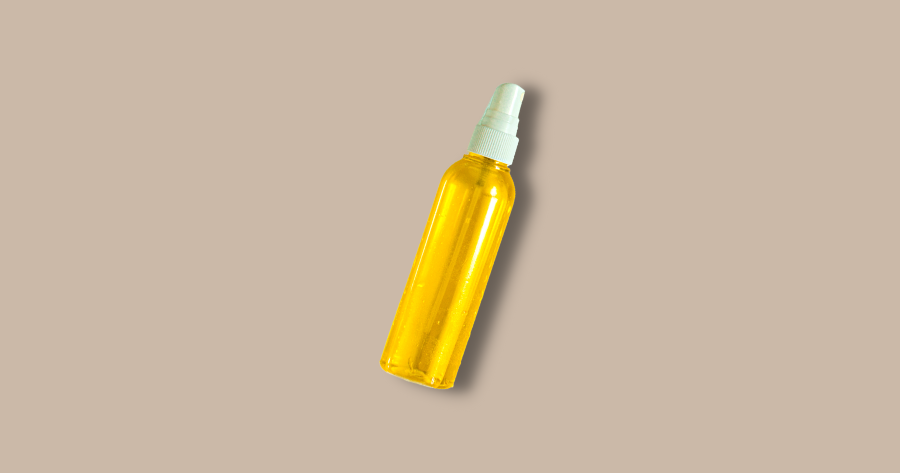 yellow spray bottle against brown background